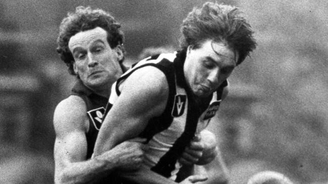 Billy Picken is tackled during a game against Fitzroy in 1983.