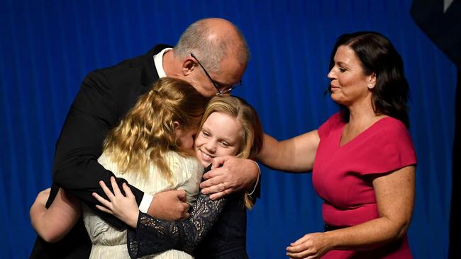 Australia's Prime Minister Scott Morrison at today’s launch in Melbourne, with his daughters and wife Jenny Morrison. Picture: William West/AFP