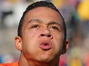 SAO PAULO, BRAZIL - JUNE 23: Memphis Depay of the Netherlands celebrates scoring his team's second goal during the 2014 FIFA World Cup Brazil Group B match between the Netherlands and Chile at Arena de Sao Paulo on June 23, 2014 in Sao Paulo, Brazil. (Photo by Dean Mouhtaropoulos/Getty Images)