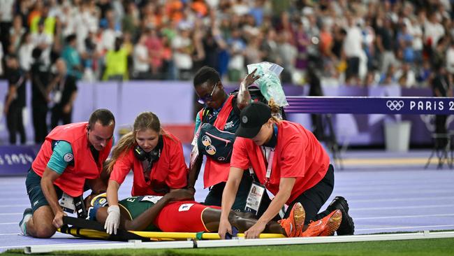 Medical staff rushed to his side. Picture: Andrej Isakovic/AFP