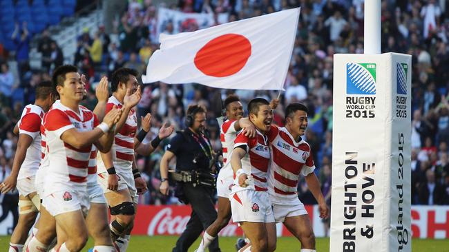 BRIGHTON, ENGLAND - SEPTEMBER 19: Japan players celebrate their surprise victory in the 2015 Rugby World Cup Pool B match between South Africa and Japan at the Brighton Community Stadium on September 19, 2015 in Brighton, United Kingdom. (Photo by Charlie Crowhurst/Getty Images)