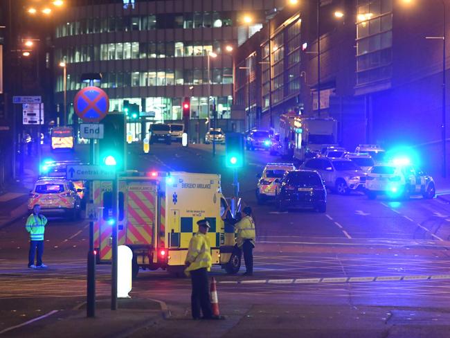 Emergency response vehicles are parked at the scene of a suspected terrorist attack during a pop concert by US star Ariana Grande in Manchester. Picture: AFP