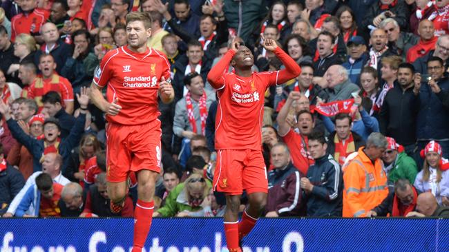 Liverpool's English striker Daniel Sturridge (R) celebrates scoring his team's second goal.