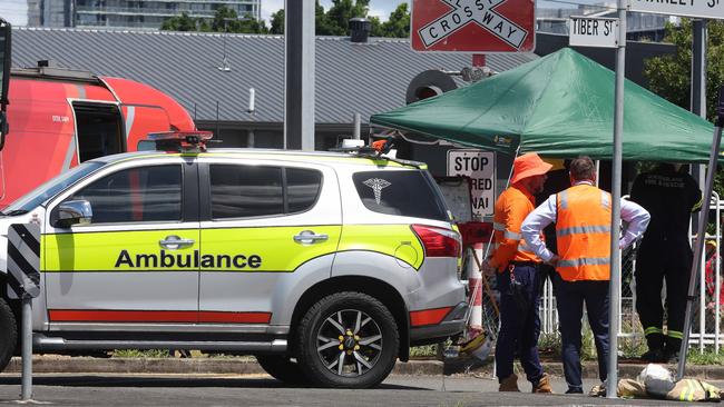 Police, Ambulance and Fire personnel all at the scene where a pedestrian has been hit by a train, Stanley Street East level crossings, Coorparoo. Picture: Liam Kidston