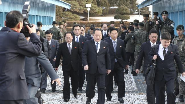 The head of North Korean delegation Ri Son Gwon, centre, arrives at the South side for the meeting with South Korea at the Panmunjom in the Demilitarized Zone in Paju, South Korea. Picture: AP