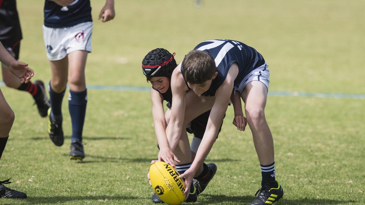 Darcy Johnston (left) of South Toowoomba Bombers and Rohan Gaffney of Coolaroo in U14 AFL Darling Downs grand final at Rockville Park, Saturday, September 2, 2023. Picture: Kevin Farmer