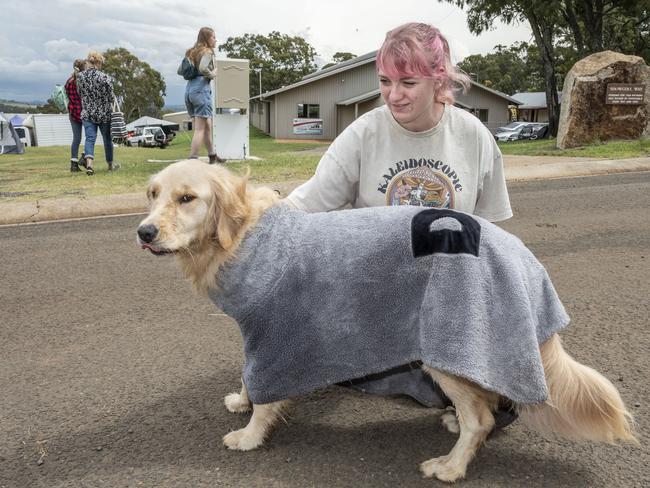 Lauren Toone with Dock Dogs competitor Honey the golden retriever at the Toowoomba Royal Show. Saturday, March 26, 2022. Picture: Nev Madsen.