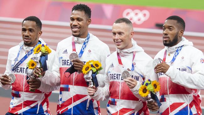 TOKYO, JAPAN August 7:  CJ Ujah, Zharnel Hughes, Richard Kilty and Nethaneel Mitchell-Blake of Great Britain with their silver medals on the podium after the 4 x 100m relay for men during the Track and Field competition at the Olympic Stadium at the Tokyo 2020 Summer Olympic Games on August 7th, 2021 in Tokyo, Japan. (Photo by Tim Clayton/Corbis via Getty Images)