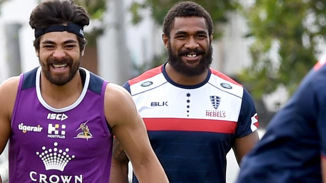 Marika Koroibete training with Melbourne Rebels at Gosh's Paddock while a former tea mate pops over to say hi as both teams train at the same time at Gosh's paddock. Former Melbourne Storm NRL star Marika Koroibete has his first training session since crossing codes. Picture: Nicole Garmston