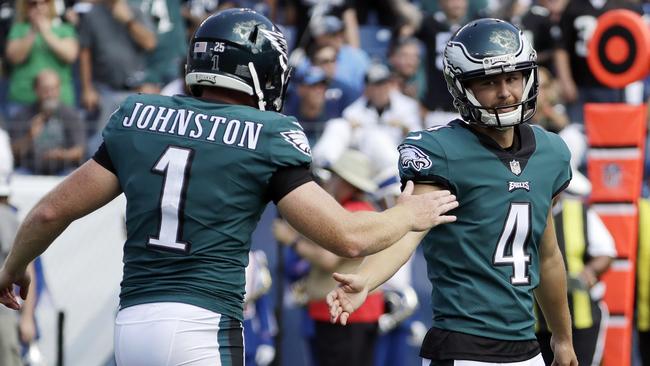 A high-five for the holder: Philadelphia Eagles kicker Jake Elliott and Cameron Johnston. Picture: AP