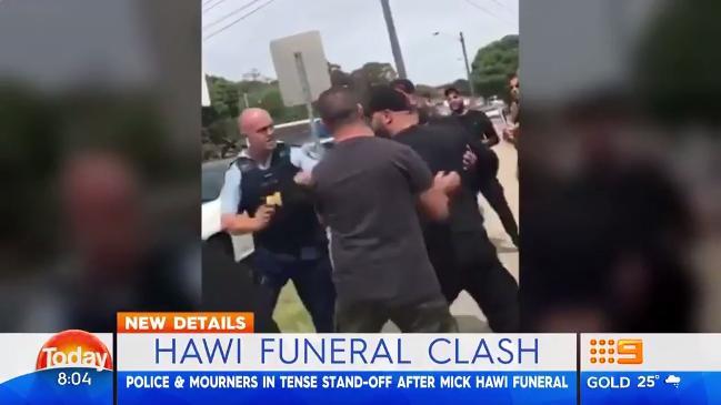 Police and mourners clash on way to bikie boss' funeral