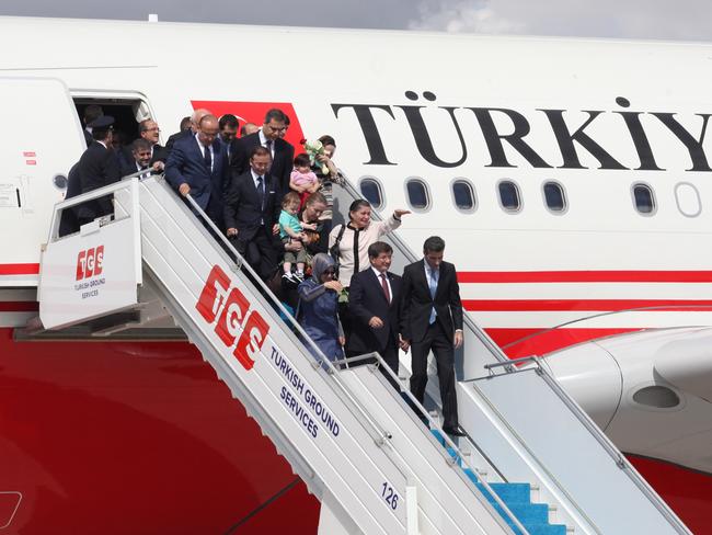 Problem on the border ... the Turkish Prime Minister Ahmet Davutolu with released Turkish hostages who had been seized by ISIS in northern Iraq in June. Picture: Basin Foto Ajansi/LightRocket via Getty Images