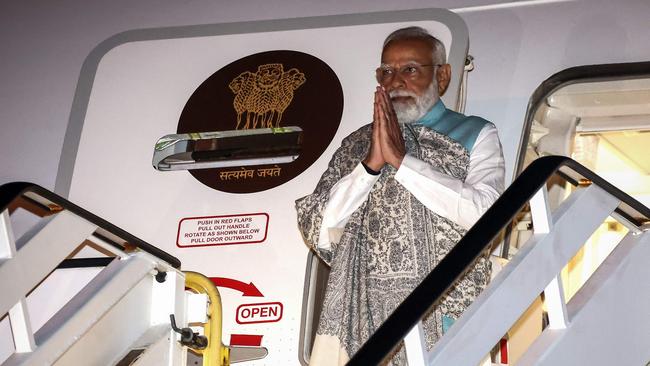 India's Prime Minister Narendra Modi alights from his aircraft at the Sydney international airport on Monday night. Picture: David Gray / POOL / AFP