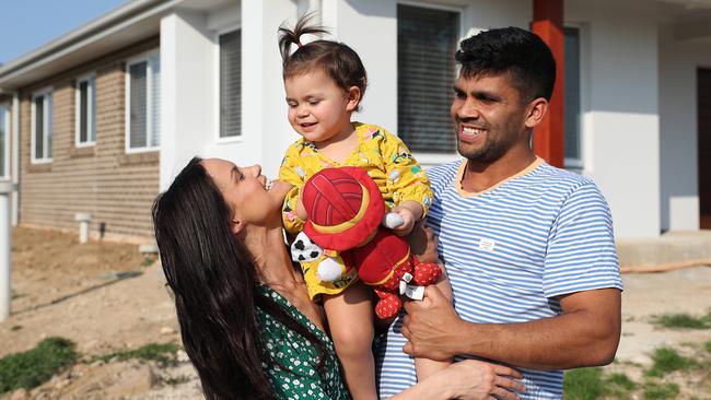 Peachey with partner Kellie Rose and daughter Penelope at their new home in Penrith. (Brett Costello)