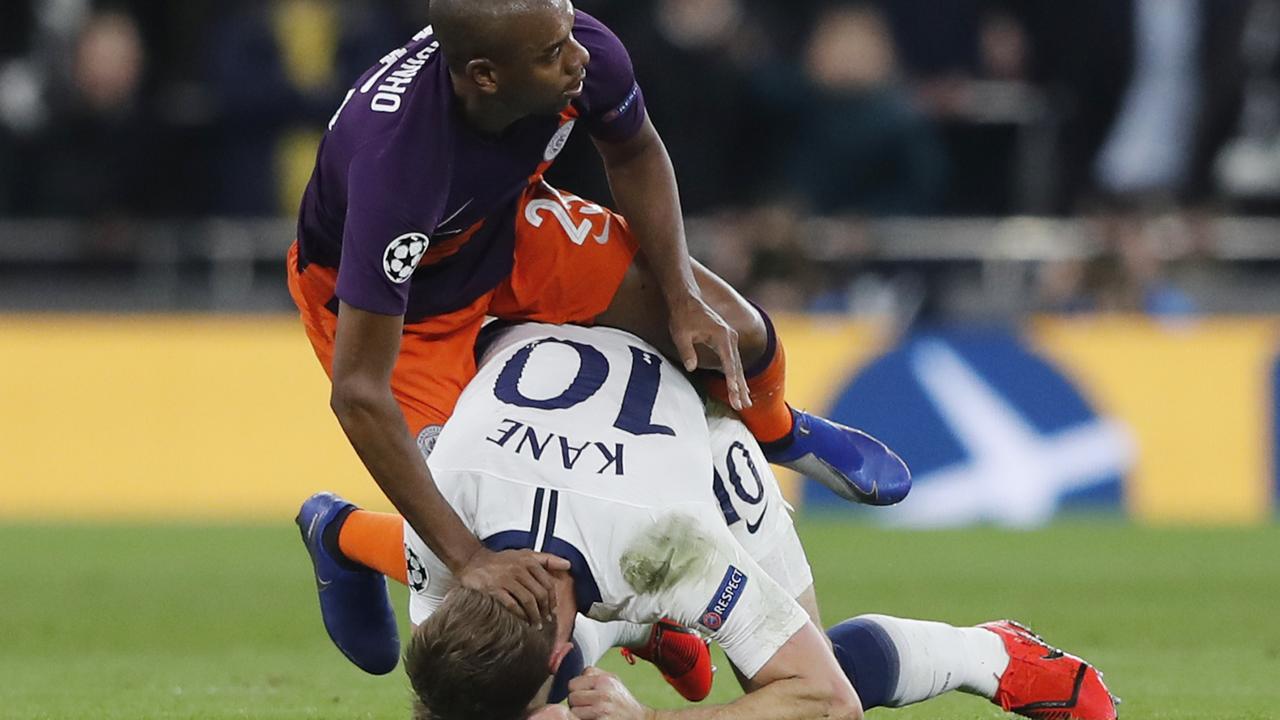 Tottenham's Harry Kane, right, is fouled by Manchester City's Fernandinho