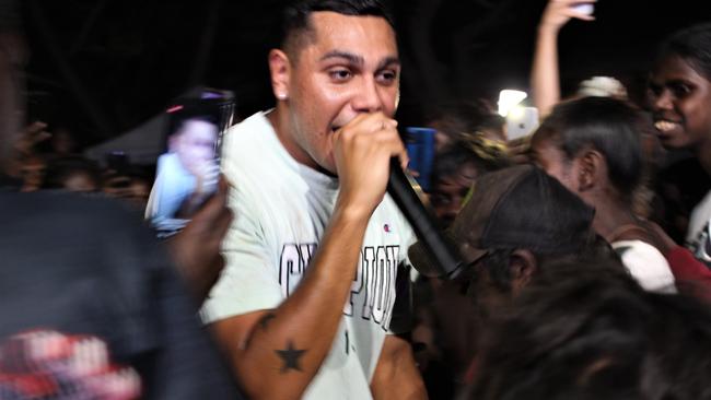 Fans watch Darwin-born rapper J-MILLA perform live in Wadeye on June 1, 2023 while the concert is streamed live on TikTok. Picture: Jason Walls