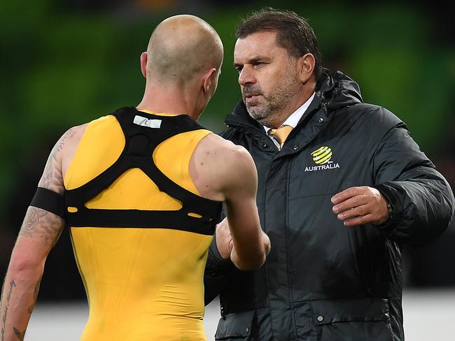 Coach of the Socceroos Ange Postecoglou (right) and Aaron Mooy are seen after the 2018 FIFA World Cup Qualifier between Australia and Thailand at AAMI Park in Melbourne, Tuesday, September 6, 2017. (AAP Image/Julian Smith) NO ARCHIVING, EDITORIAL USE ONLY