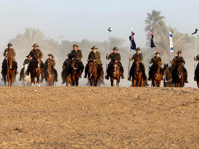 Members of the Australian Light Horse association ride near Beersheva in the southern Israeli desert on October 31, 2017 during a re-enactment of the historical fight of the ANZAC where forces captured the area from the Ottoman Empire during the First World War. Picture: AFP.