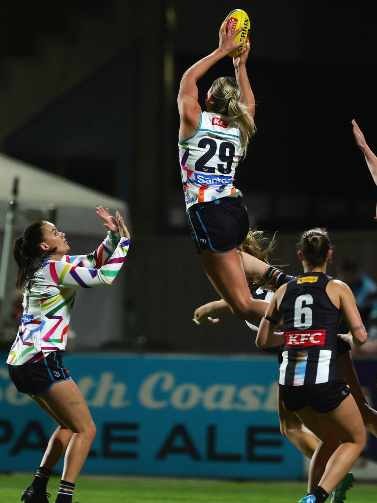 Scholz rises for her hanger against Collingwood. Picture: Sarah Reed/AFL Photos via Getty Images