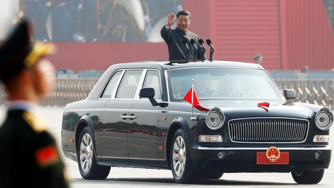 Chinese President Xi Jinping waves from a vehicle as he reviews the troops at a military parade marking the 70th founding anniversary of People's Republic of China in 2019.