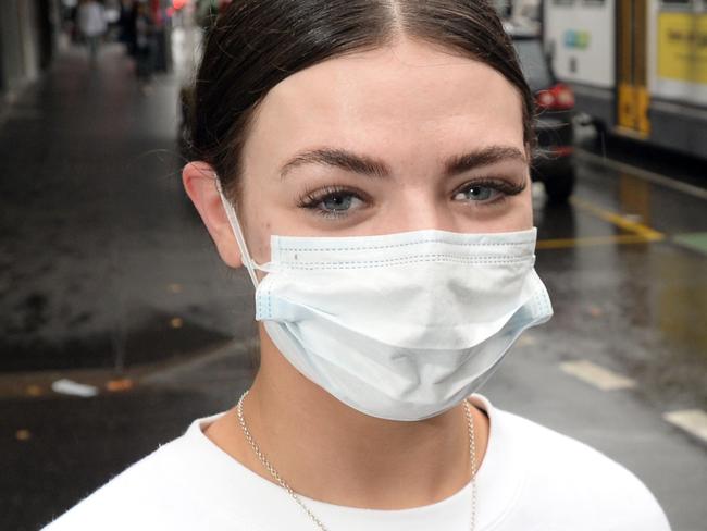 Flatmates Courtney Russ and Laura McCann have started wearing face masks in public, including when he's walking along Chapel Street, after the recent spike in COVID-19 cases in Melbourne. Picture: Andrew Henshaw