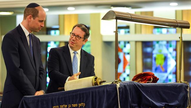 Rabbi Daniel Epstein shows Britain's Prince William, Prince of Wales a 17th century Torah scroll during a visit to the Western Marble Arch Synagogue, in London, on February 29, 2024. Picture: Toby Melville / POOL / AFP