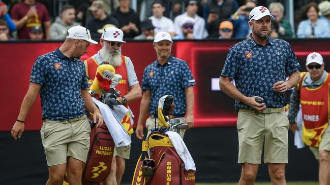 Matt Jones ,Marc Leishman and Lucas Herbert on the 12th hole. Photo by Mark Brake/Getty Images)