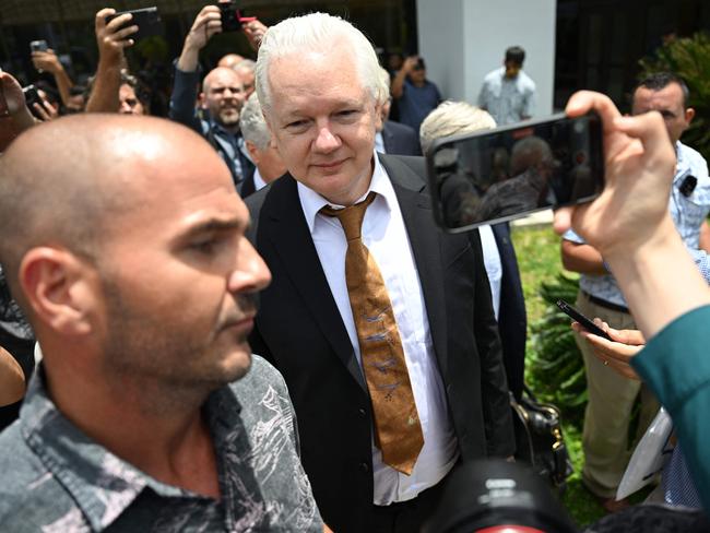 Assange was surrounded by a media pack as he left court. Picture: AFP