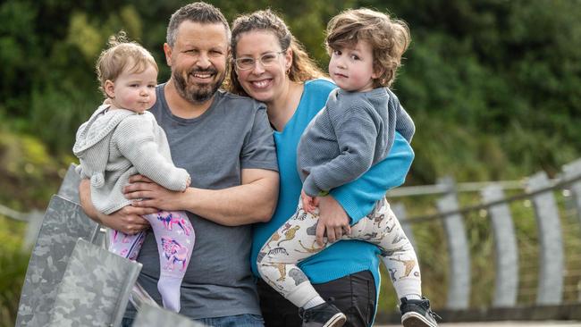 Paul Hughes with his partner Shauna Ross and and children Archie Hughes (3) and Charlie Hughes (11months GIRL). Paul was diagnosed with metastatic breast cancer and given just 18 months to live. But he's responding well to treatment and is about to embark on a bucket list holiday with his family. Picture: Tony Gough