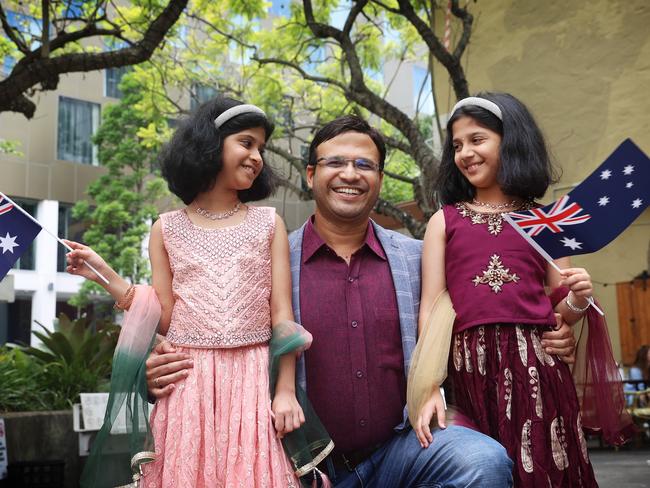 Australia Day 2025..26/1/25: Ashutosh Phatak with daughters, Sharveyi (maroon dress) and Anwesha  (pink dress). Ashutosh and his 2 daughters became Australian citizens at the Parramatta Citizenship Ceremony. John Feder/The Australian.