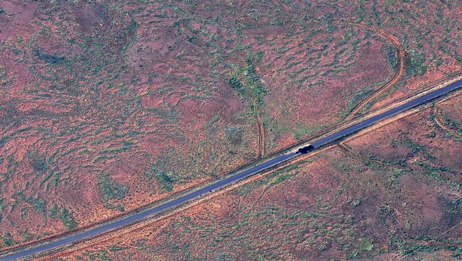 A semi-trailer on a bitumen strip of the Strzelecki Track.