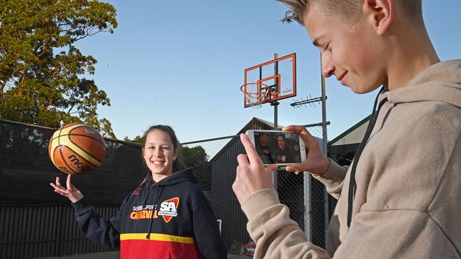 Tayla, 12, and Will, 17, prefer to get outside and play basketball than be on their screens for too long. Picture: Tom Huntley