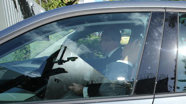 Paul Keating covers his face as he arrives for a meeting with Chinese Foreign Minister Wang Yi in Sydney. Picture: Britta Campion