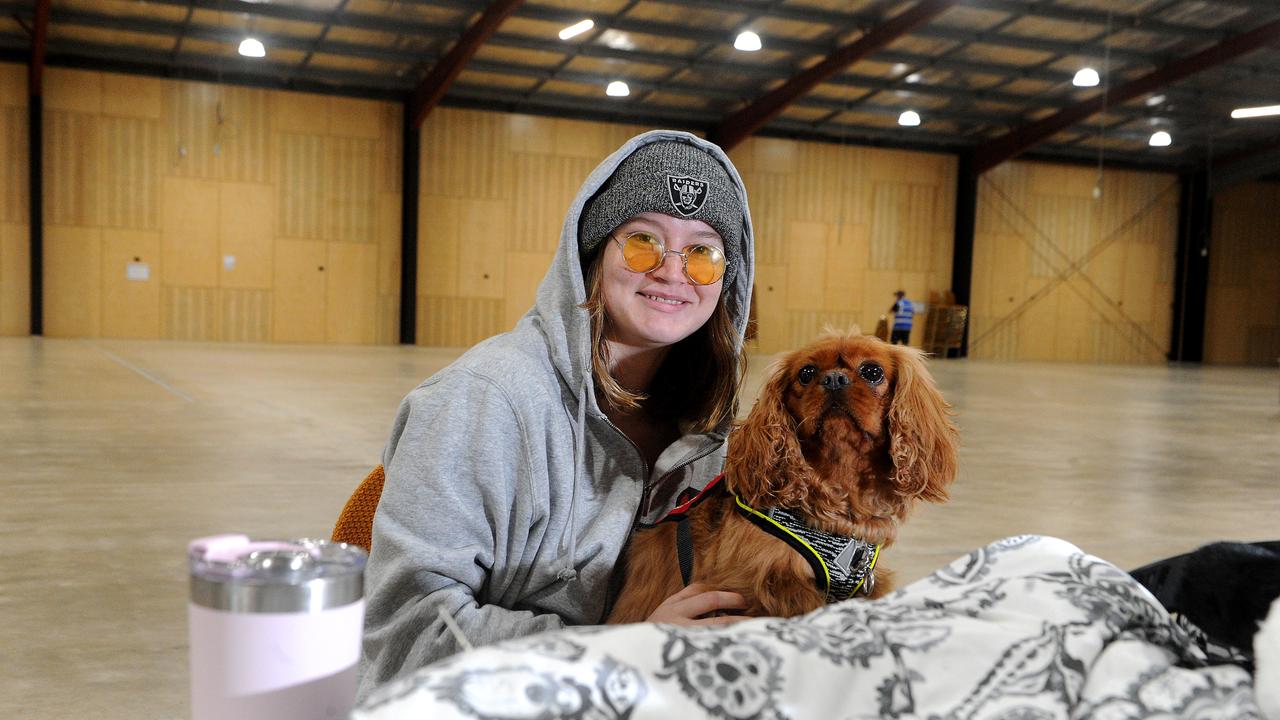 Kirra Tange and her dog Charlie at the refuge centre in Ipswich. Picture: John Gass