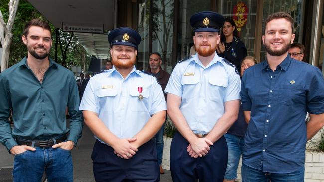 Thousands of people have braved the rain to gather in Brisbane for Anzac Day services. Picture: Grace Kessels