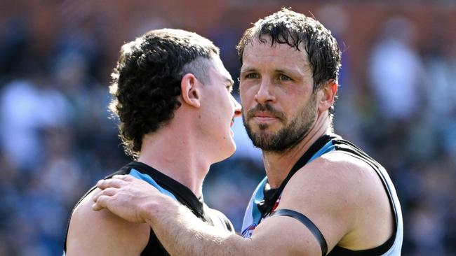 Darcy Byrne-Jones and Travis Boak of Port Adelaide celebrate the win after the round 24 AFL match between Port Adelaide Power and Richmond Tigers at Adelaide Oval, on August 27, 2023, in Adelaide, Australia. (Photo by Mark Brake/Getty Images)