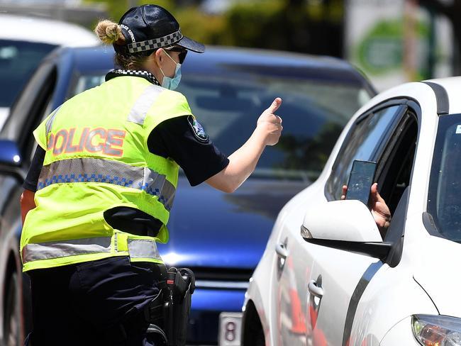 Vehicles queue up at the NSW-Qld border as police check who enters. Picture: Dan Peled