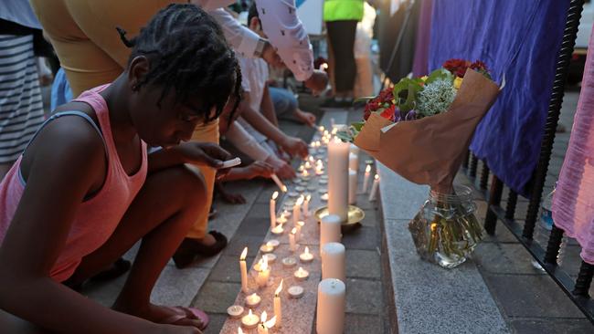 Prays are said and candles are lit outside Notting Hill Methodist Church near the Grenfell Tower block. Picture: Getty Images.