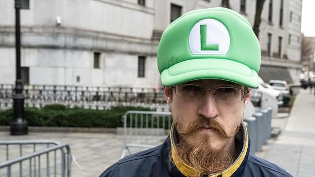 A pro-Luigi demonstrator gathers outside the federal court house. Picture: Getty Images via AFP