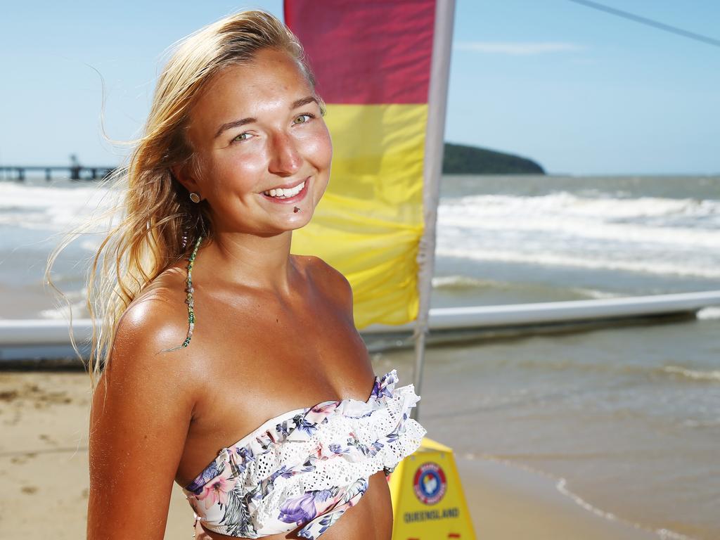 Jana Riek swims safely between the stinger nets at Palm Cove in Cairns. Picture: Brendan Radke