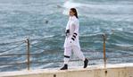 A model parades an outfit by fashion label Tenpieces at Bondi Beach during Fashion Week Australia in Sydney on April 16, 2015. AFP PHOTO / William WEST