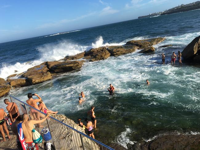 Despite the warnings, hundreds of people were seen swimming at Giles Baths (above) and the beach yesterday and today.