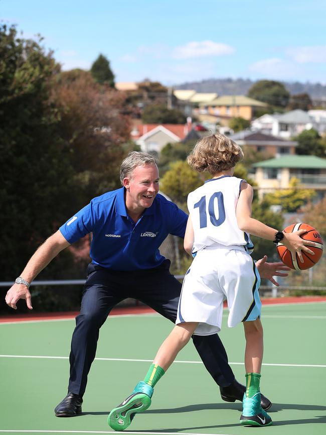 Premier Will Hodgman plays some one-on-one with Archie Stewart, 12, of the Kingston Kings after announcing commitment to new multi-sport facility to be built in Glenorchy. Picture: SAM ROSEWARNE