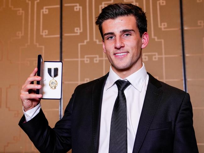 MELBOURNE, AUSTRALIA - OCTOBER 04: Nick Daicos poses for a photo after winning the E.W Copeland Trophy during the Collingwood Magpies Best And Fairest Awards at Crown Palladium on October 04, 2024 in Melbourne, Australia. (Photo by Asanka Ratnayake/AFL Photos/via Getty Images)