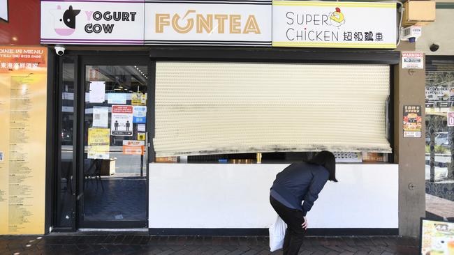 The damaged roller window at the Fun Tea bubble tea shop on Gouger Street. Picture: Naomi Jellicoe