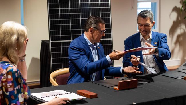 Chief Minister Michael Gunner and Sun Cable chief executive David Griffin sign the project development agreement. Picture: Che Chorley