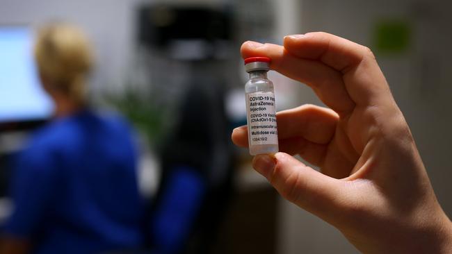 Nurse Emma McCallum handles a COVID-19 AstraZeneca vaccine vial at Sydney Road Family Medical Practice in Sydney on Tuesday. Picture: Getty Images