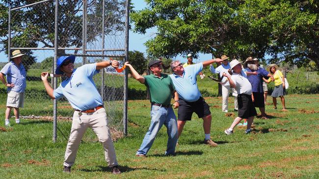 Tourists throw boomerangs at Mungalla Aboriginal Tours.