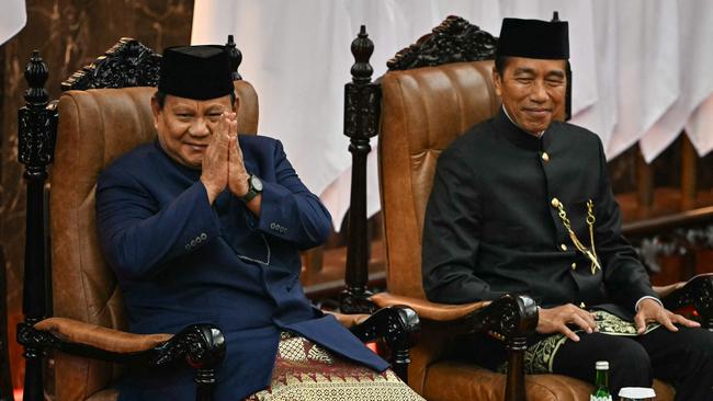 Indonesia's new President Prabowo Subianto, left, and predecessor Joko Widodo during the presidential inauguration in Jakarta on Sunday. Picture: AFP