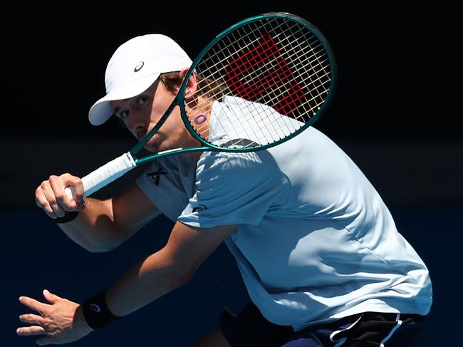 MELBOURNE, AUSTRALIA - JANUARY 12: Alex de Minaur of Australia plays a forehand during a training session ahead of the 2024 Australian Open at Melbourne Park on January 12, 2024 in Melbourne, Australia. (Photo by Graham Denholm/Getty Images)